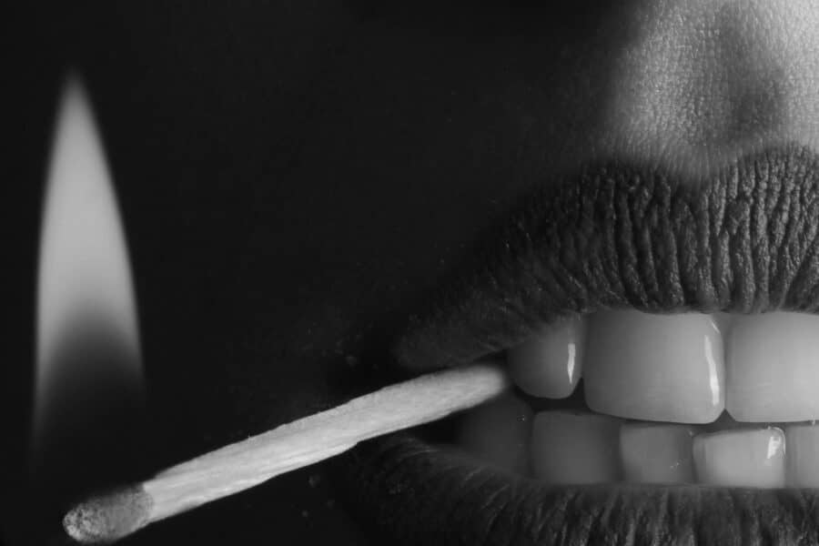 elf beauty marketing woman mouth holding fire