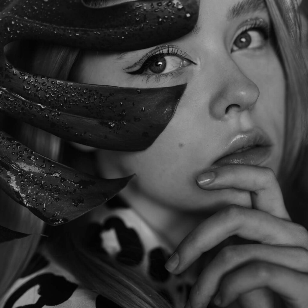 bfcm girl is looking behind a leaf