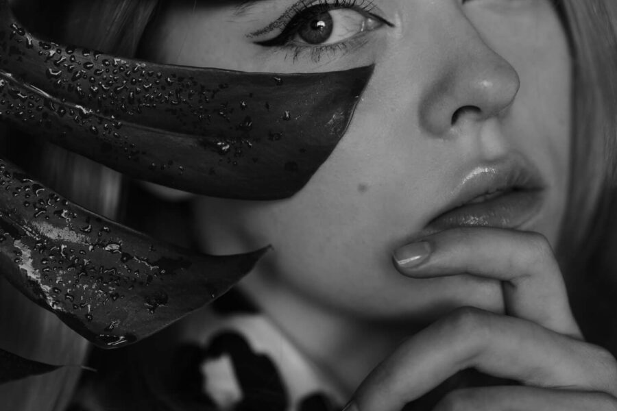 bfcm girl is looking behind a leaf