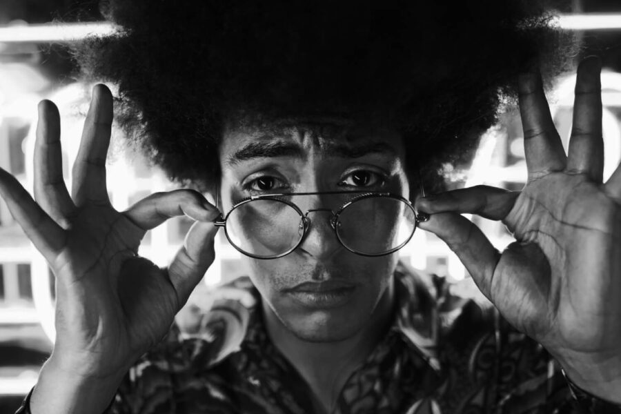 tiktok marketing curly hair guy looking at the camera