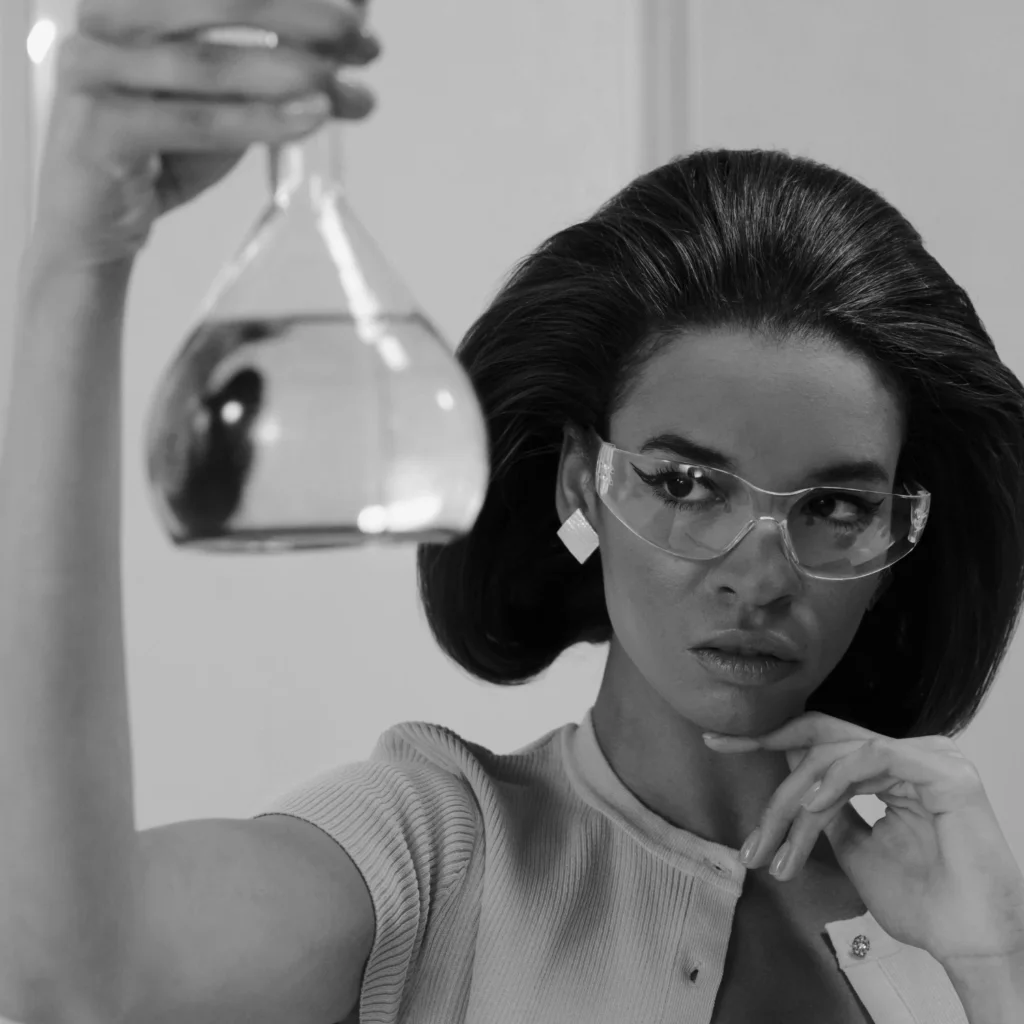 fragrance marketing, a lady is holding a fragrance bottle